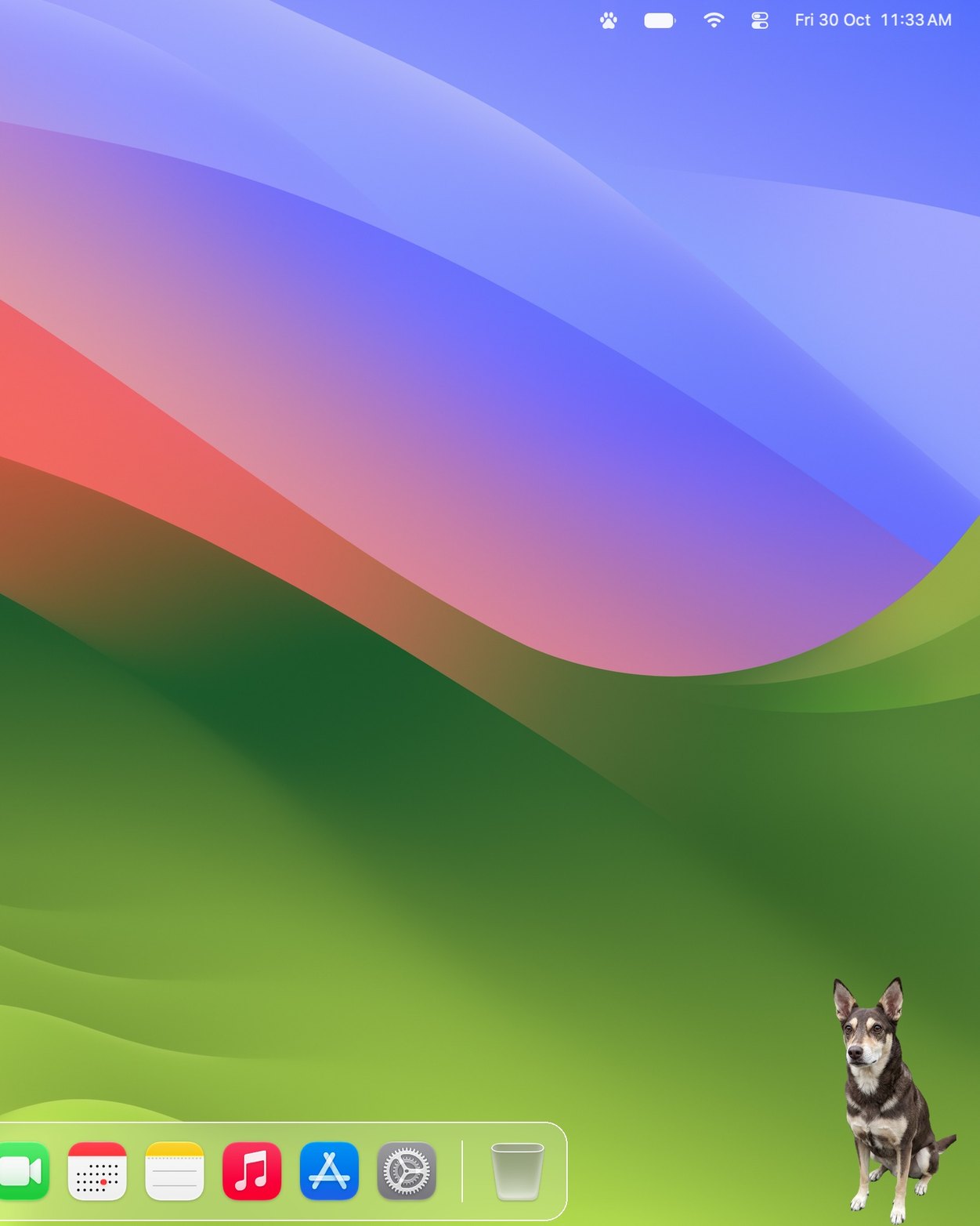 A Mac desktop with Cookie sitting in the bottom-right corner, beside the Dock